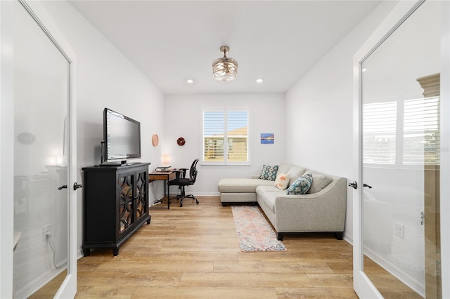 living room with light hardwood / wood-style flooring