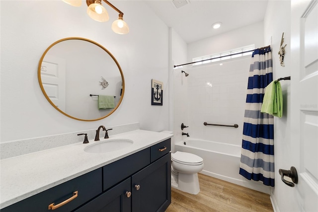 full bathroom featuring shower / bath combination with curtain, vanity, toilet, and hardwood / wood-style floors