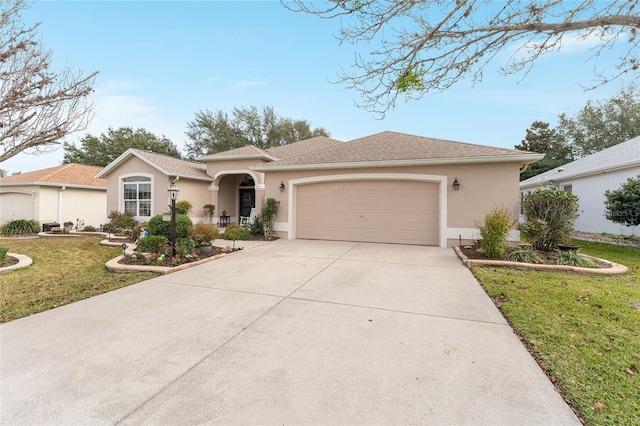 view of front of property with a garage and a front yard