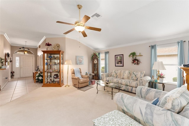 carpeted living room with lofted ceiling, crown molding, and ceiling fan