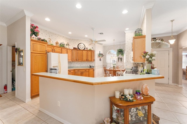 kitchen featuring light tile patterned floors, crown molding, a kitchen breakfast bar, white fridge with ice dispenser, and kitchen peninsula