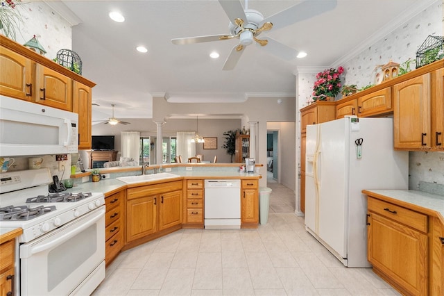 kitchen featuring crown molding, white appliances, kitchen peninsula, and sink