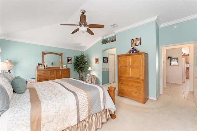 carpeted bedroom featuring lofted ceiling, ornamental molding, ceiling fan, and white refrigerator