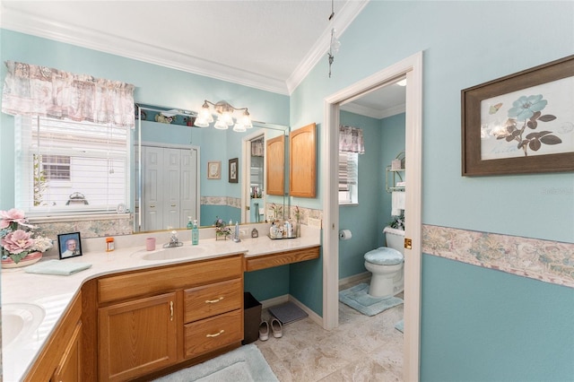 bathroom featuring vanity, crown molding, and toilet