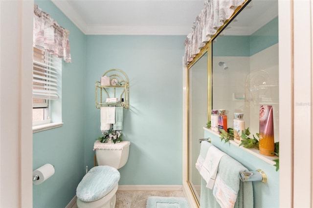 bathroom featuring toilet and a shower with door