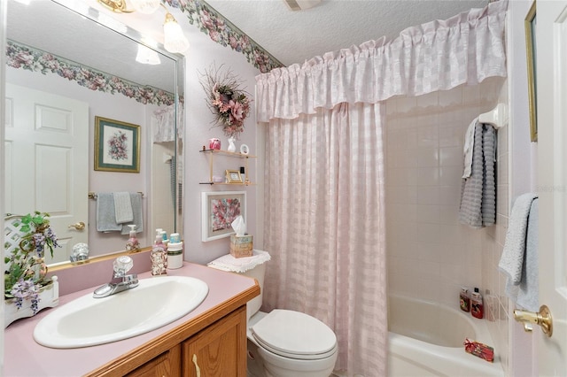 full bathroom featuring toilet, vanity, shower / bathtub combination with curtain, and a textured ceiling