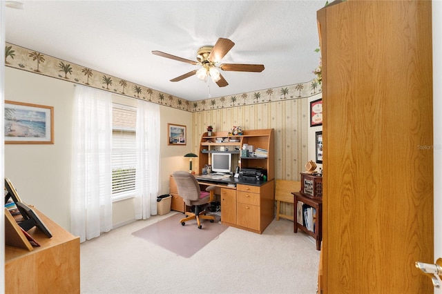 office area featuring light carpet and ceiling fan