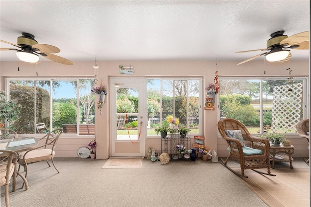 sunroom / solarium with ceiling fan