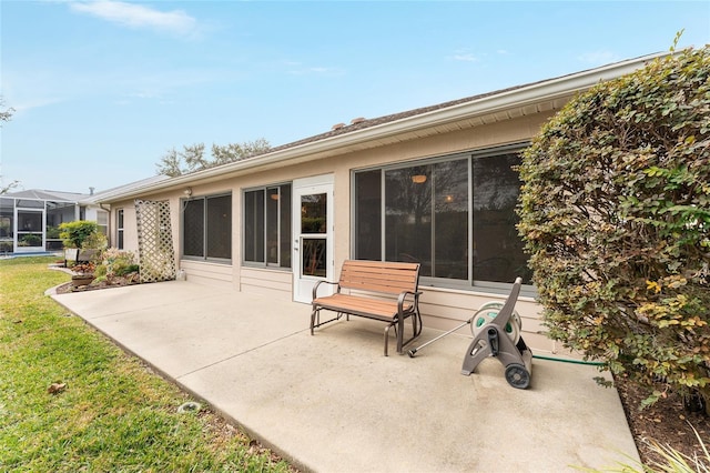 rear view of property with a yard and a patio area