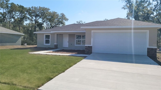 view of front of home featuring a garage and a front lawn