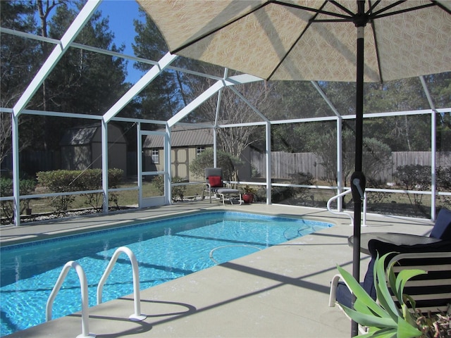 view of pool featuring a patio area and glass enclosure