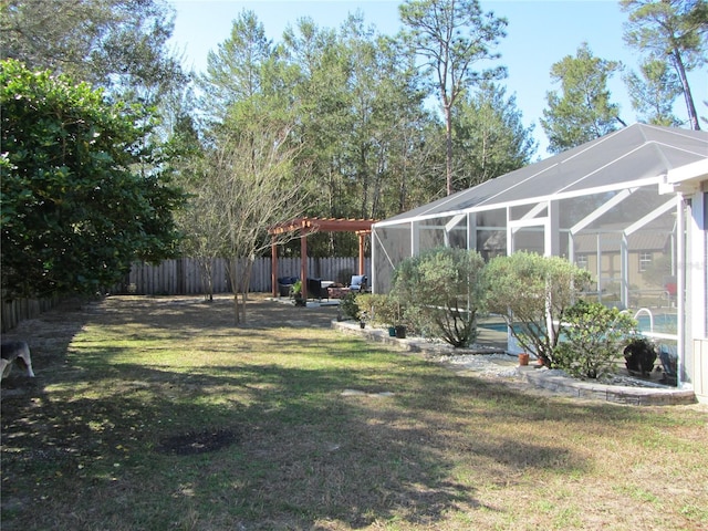 view of yard featuring a fenced in pool, a lanai, and a pergola