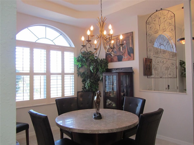 dining space featuring a notable chandelier