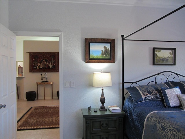 bedroom with light tile patterned floors