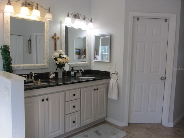 bathroom with tile patterned flooring and vanity