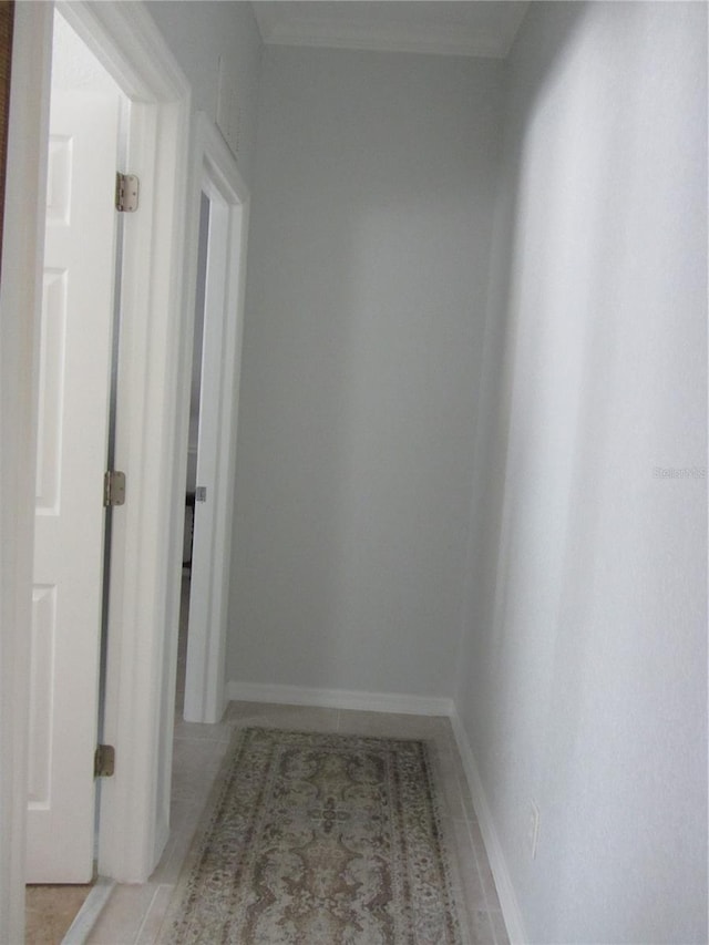 hall featuring light tile patterned floors