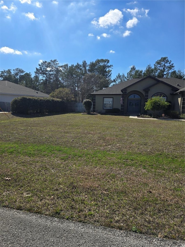 exterior space with a front lawn