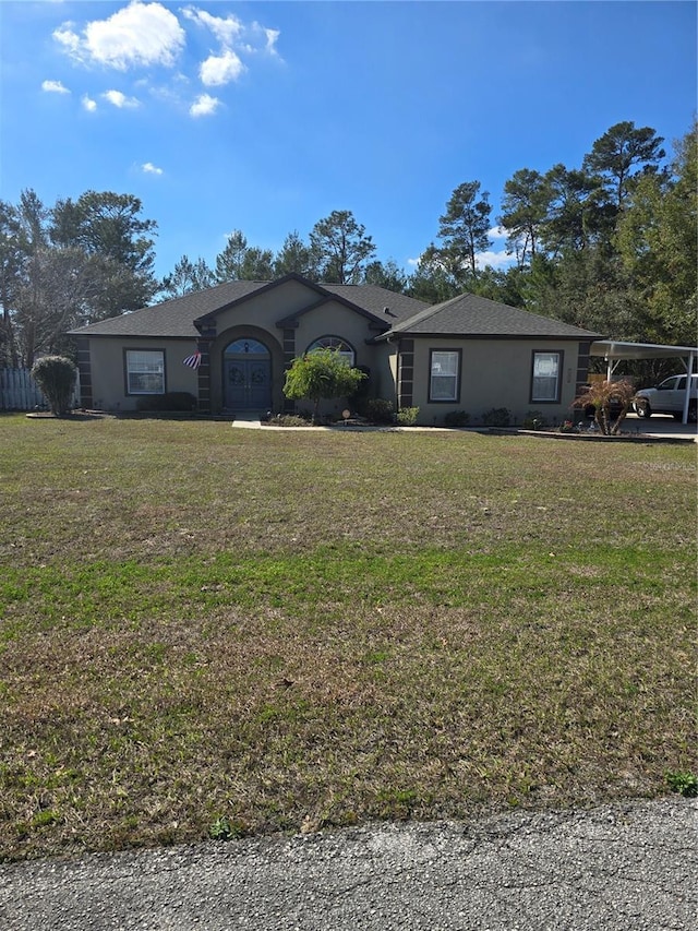 single story home featuring a front yard