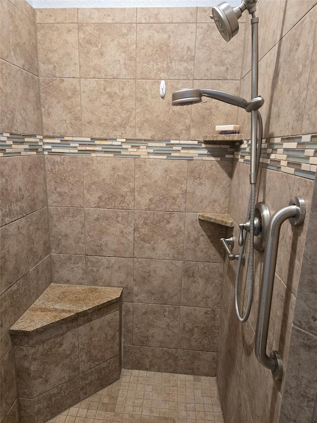 bathroom with tiled shower