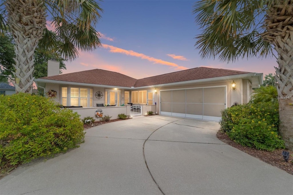 ranch-style home with a garage