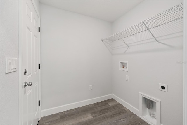 laundry area with laundry area, hookup for a washing machine, baseboards, hookup for an electric dryer, and dark wood-style floors
