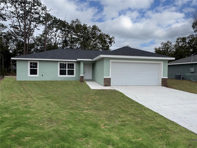 ranch-style home with a garage, central AC, and a front lawn