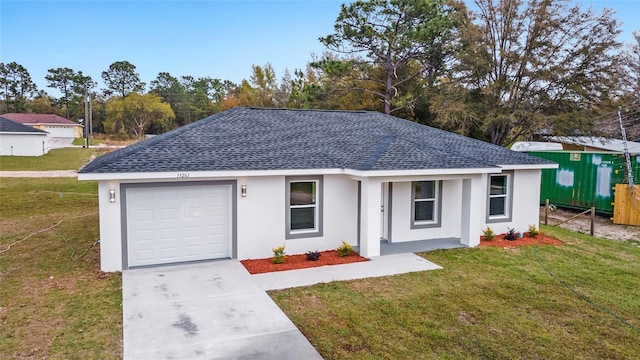 single story home with a garage and a front yard