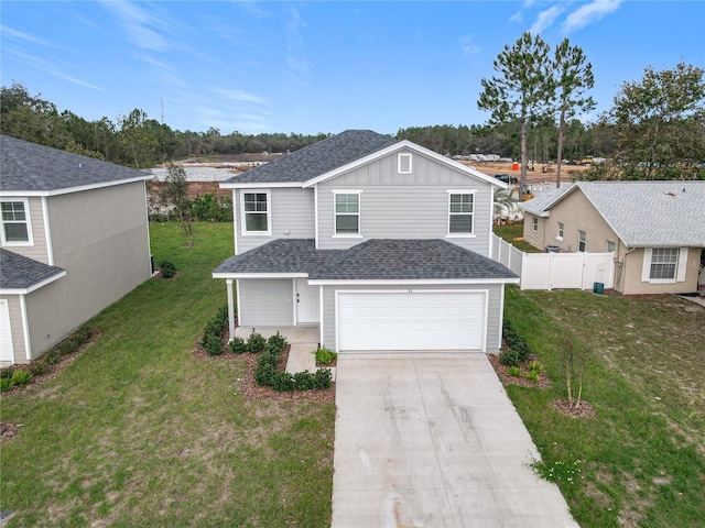 view of front of house featuring a garage and a front yard