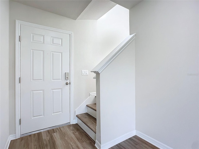 35 Wood Acre Ln, Palm Coast, FL 32164 - stairway featuring wood-type flooring