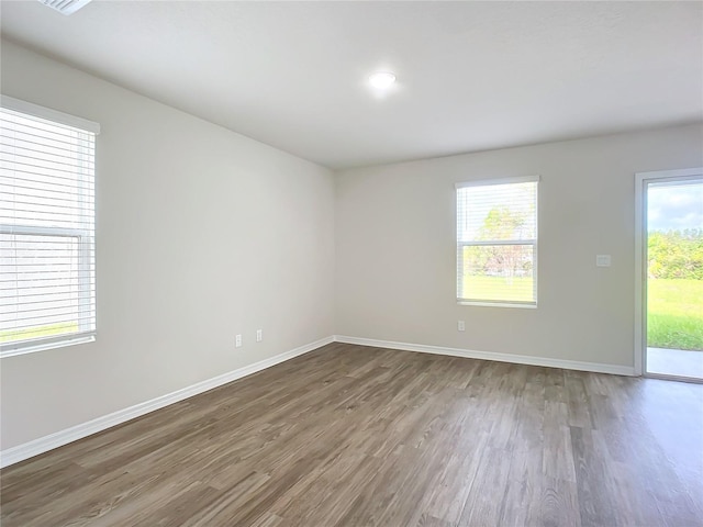35 Wood Acre Ln, Palm Coast, FL 32164 - spare room featuring dark wood-type flooring