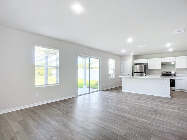 35 Wood Acre Ln, Palm Coast, FL 32164 - unfurnished living room featuring light wood-type flooring