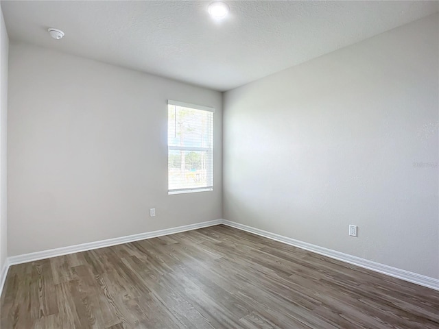 35 Wood Acre Ln, Palm Coast, FL 32164 - unfurnished room featuring hardwood / wood-style floors and a textured ceiling