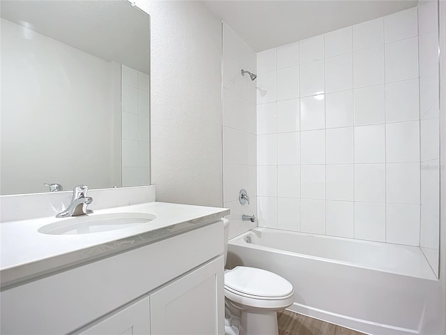35 Wood Acre Ln, Palm Coast, FL 32164 - full bathroom with vanity, hardwood / wood-style flooring, toilet, and tiled shower / bath