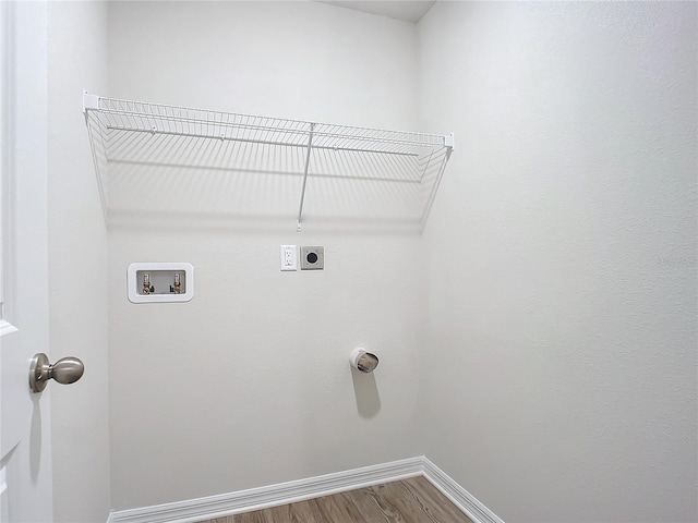 35 Wood Acre Ln, Palm Coast, FL 32164 - laundry area with hardwood / wood-style flooring, hookup for a washing machine, and electric dryer hookup