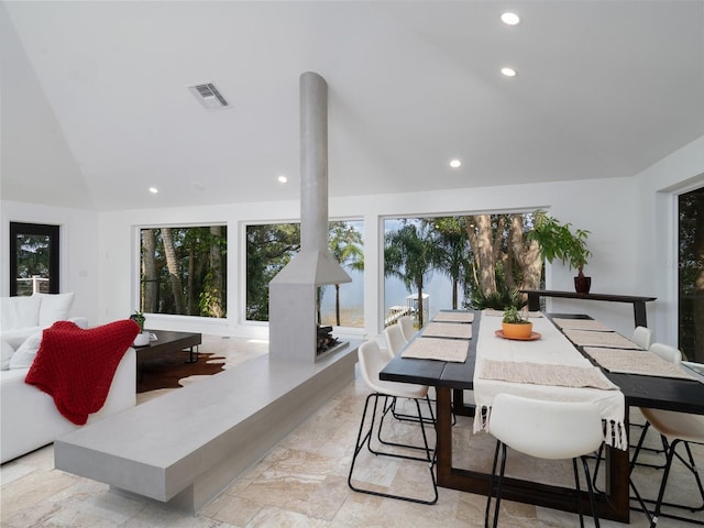 dining room featuring lofted ceiling