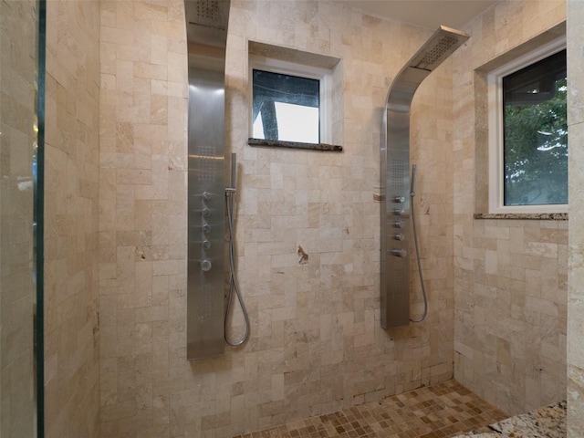 bathroom with tiled shower