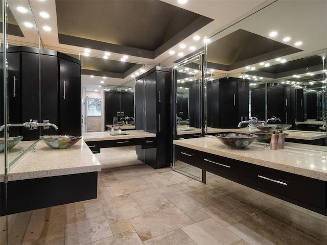 bathroom featuring vanity and a raised ceiling