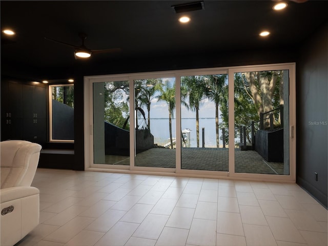 doorway featuring ceiling fan