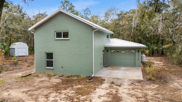 view of side of home featuring a garage