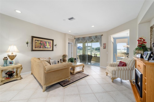 living room featuring a chandelier, light tile patterned flooring, recessed lighting, visible vents, and baseboards