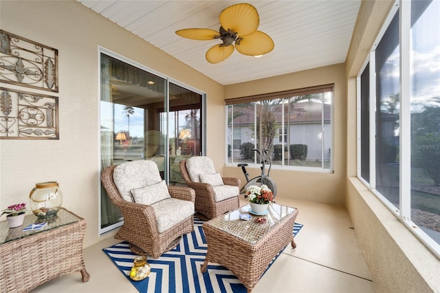 sunroom with a ceiling fan