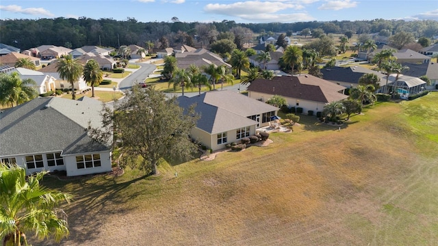 birds eye view of property with a residential view