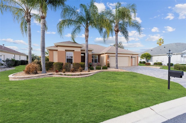 view of front of property with decorative driveway, stucco siding, an attached garage, and a front yard