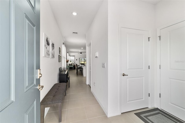 hallway featuring light tile patterned flooring