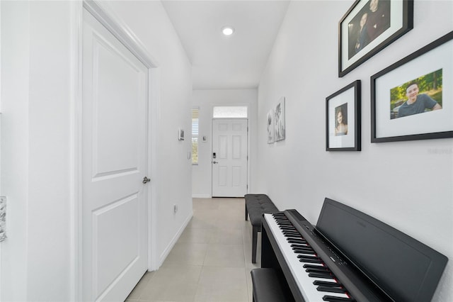 hall with light tile patterned floors