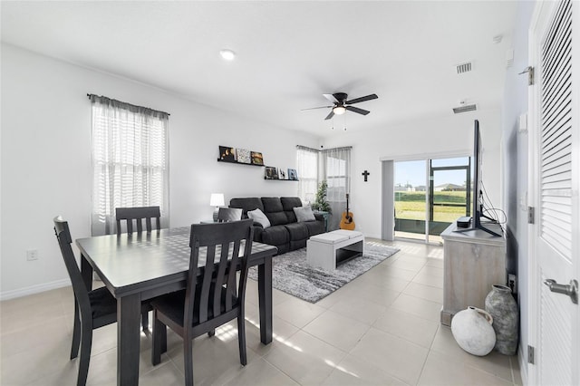 dining area featuring light tile patterned flooring and ceiling fan