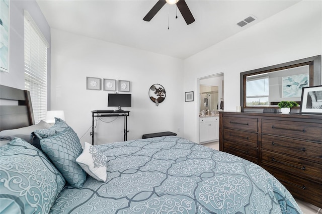 bedroom with ceiling fan and ensuite bath