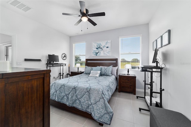 tiled bedroom with ceiling fan