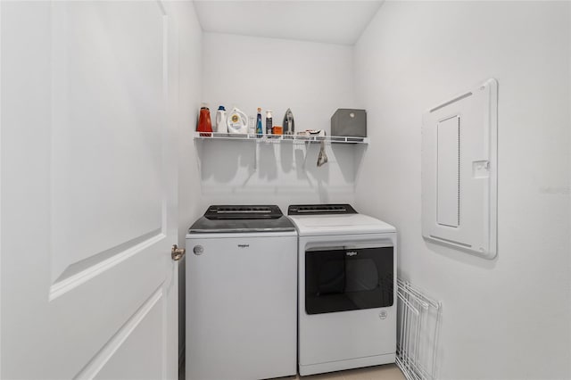 laundry room featuring separate washer and dryer and electric panel