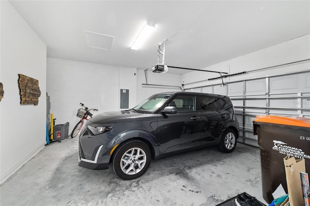 garage featuring a garage door opener and electric panel